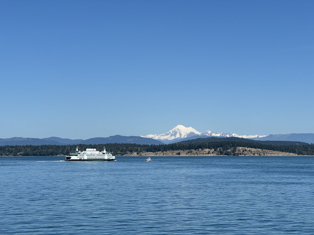 A Washington State Ferry somewhere near the San Juan Islands, with Mount Baker in the background.